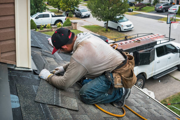 Professional Roofing technician working in Wellsville, MO